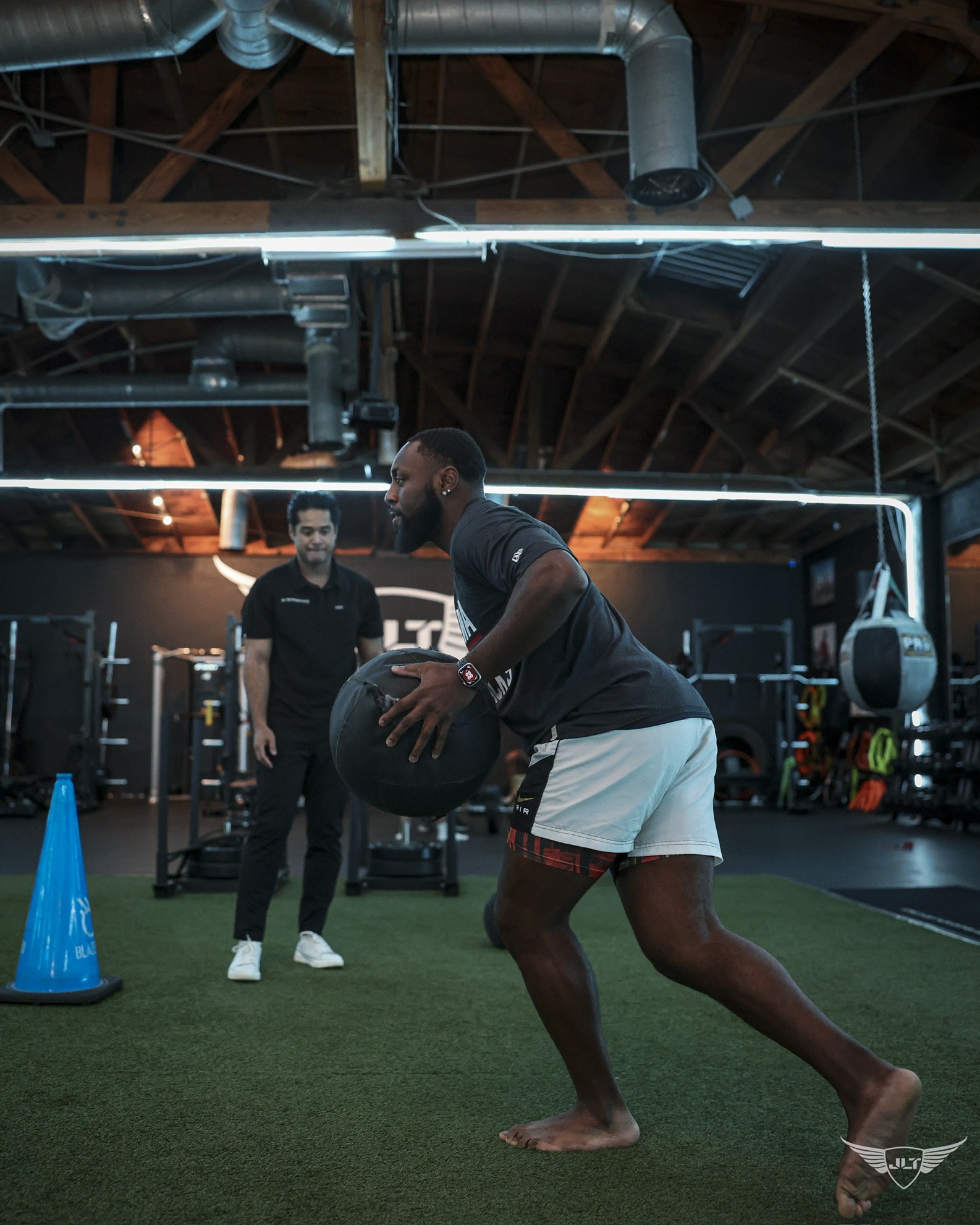 Athlete training with Dr. Tim in a performance gym